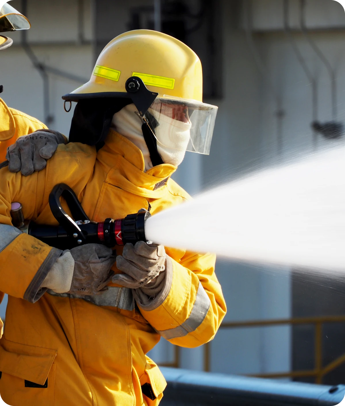 Firefighters spraying water from a hose.